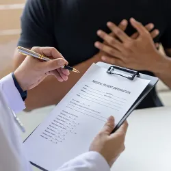 A nurse practitioner giving an exam to a patient 